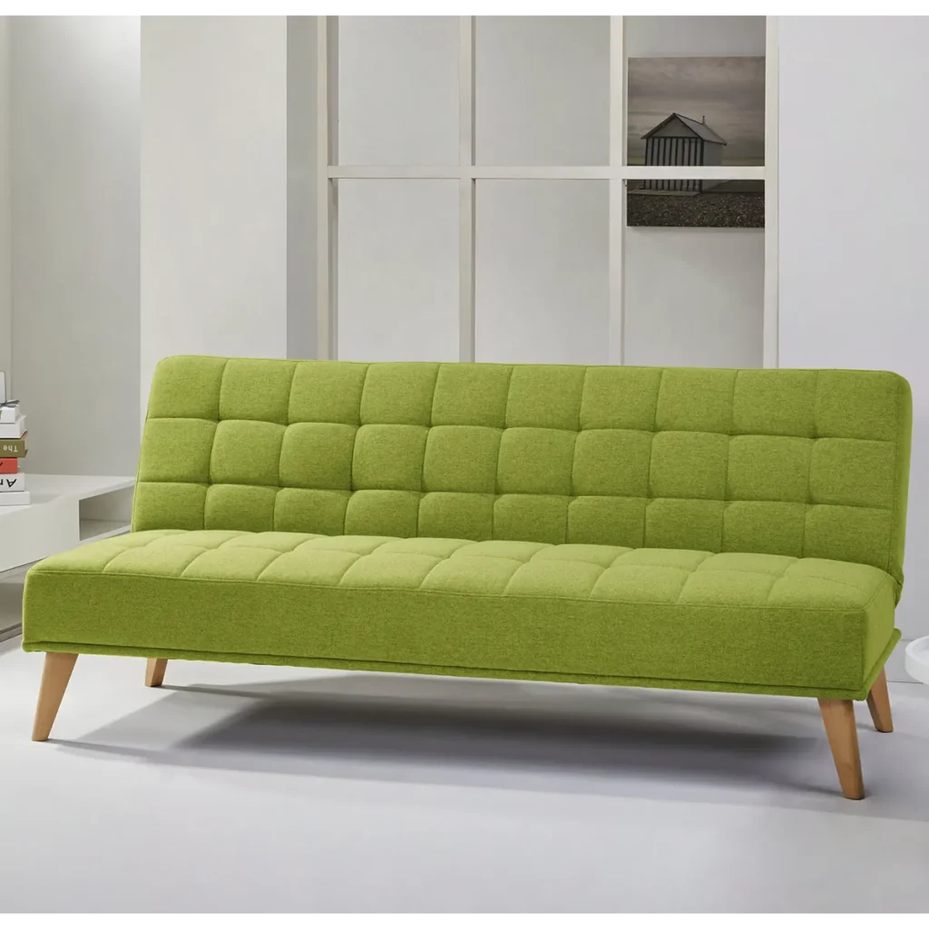 A lime green Aquila Click Clack sofabed with a quilted texture in a modern living room setting.