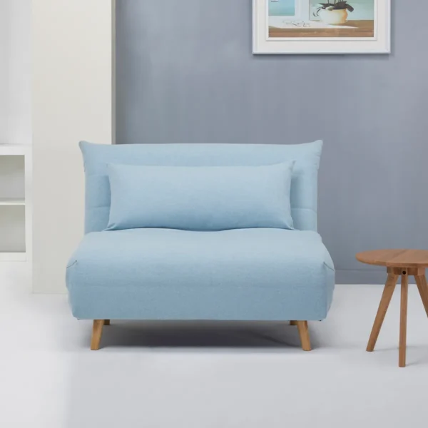 A light blue Carina Click Clack sofabed in a compact, upright position with a matching cushion.