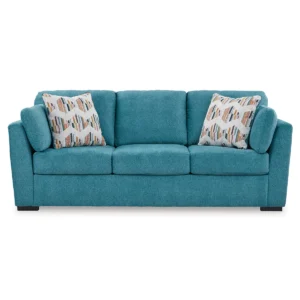 Front view of the Olivia 3-seater sofa with bold, patterned pillows, adding a pop of colour to a contemporary living room.
