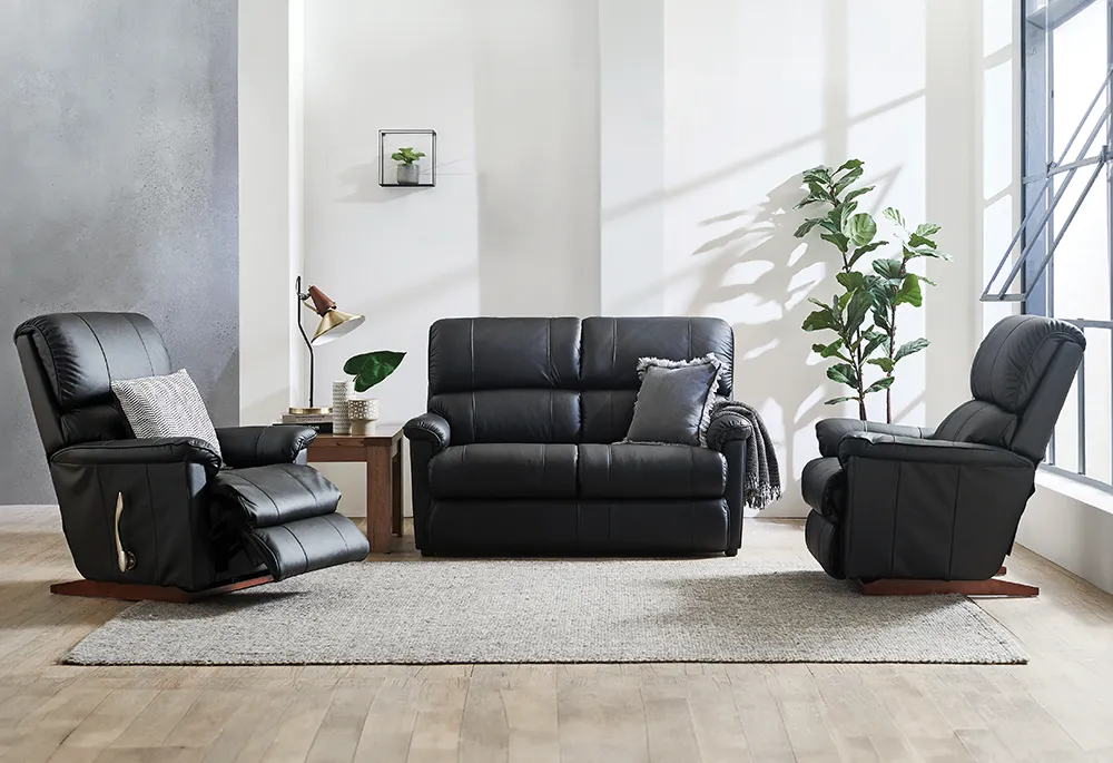 Black leather lounge set with recliners.